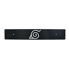 Black license plate with a white anime character logo in the center.