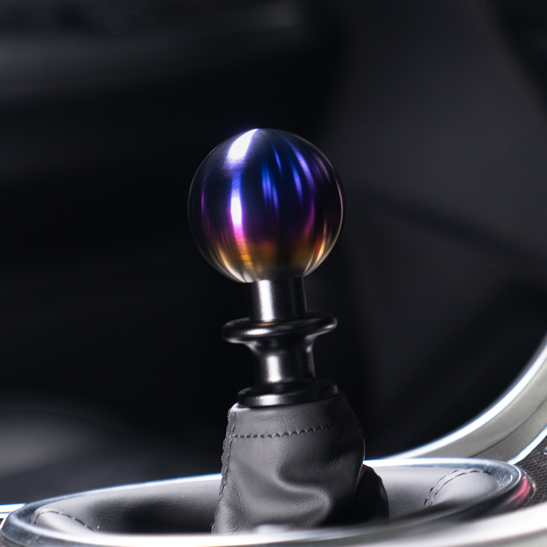 Billetworkz torched titanium shift knob installed in a car