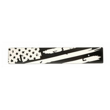 A black and white distressed American flag design on a license plate delete.