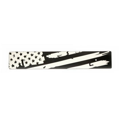 A black and white distressed American flag design on a license plate delete.